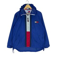 PLEASE ASK ANY QUESTION BEFORE BUYING  THIS IS USED CLOTHING PLEASE DONT EXPECTED IT TO BE LIKE NEW OR IN PRISTINE CONDITION TOMMY HILFIGER HOODIE WINDBREAKER LIGHT JACKET tag Tommy Hilfiger material Nylon 100%  saiz on tag S (Small)  Mesasures About ( Approximately)  -Armpit to Ampit : 23.5 inch -Length (back collar down) : 29 inch Condition : used good condition 8/10 **No Tears No Stains And No Hole** 🎈PLEASE READ THE DESCRIPTION AND POLICY BEFORE BUYING 🎈ACCEPT PAYMENT:  PAYPAL ONLY ALL ITE Sporty Blue Windproof Hooded Jacket, Sporty Blue Outerwear With Zip Fly, Blue Windbreaker With Double-lined Hood For Outdoor, Blue Windproof Hooded Jacket For Streetwear, Hooded Windbreaker With Zip Fly For Outdoor Activities, Blue Streetwear Windbreaker With Drawstring Hood, Blue Windbreaker With Drawstring Hood For Streetwear, Sporty Navy Windbreaker With Double-lined Hood, Sporty Blue Windbreaker With Drawstring Hood