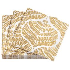 three napkins with gold leaves on them