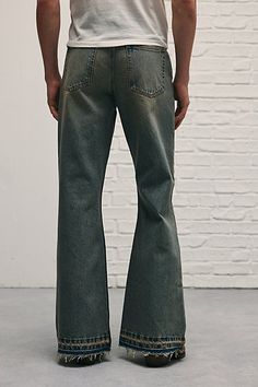 Throwback-style bell bottom jeans in 14oz. BDG denim. Relaxed fit jeans with a slouchy loose leg and wide leg openings. Only at Urban Outfitters. Features BDG Slacker relaxed fit jeans Bell bottom jeans by BDG Mid rise waist 14 oz. denim 5-pocket; zip fly Slouchy & loose fit Flared legs UO exclusive Content + Care 100% Cotton Machine wash Imported Size + Fit Model in Vintage Denim Medium is 6'2" and wearing size 32 Measurements taken from size 32 Rise: 10" Inseam: 33" Leg Opening: 12.5" | BDG Sl Gucci Bell Bottoms, 70s Pants Men, Flare Jeans Men Outfit, Bellbottom Pants Outfits Men, Cool Jeans Design, Cuffed Jeans Men, Birthday Fits Men, Mens Emo Fashion, Bootcut Jeans Outfit Men