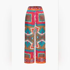 These Printed High-Waisted Wide Leg Trousers Offer A Bold And Eclectic Style. The Vibrant Patterns Create A Statement Piece, While The High-Waisted Cut Accentuates The Waist For A Flattering Silhouette. The Wide Legs Provide A Flowy And Comfortable Feel, Making Them A Versatile Choice For Both Casual And More Polished Looks. Pair Them With A Tucked-In Blouse Or A Fitted Top To Highlight The Unique Print And Silhouette. Chic Multicolor Wide Leg Pants, Chic Multicolor Wide Leg Pants With Elastic Waistband, Chic Multicolor Wide Leg Pants For Vacation, High-waisted Elastane Wide Leg Pants For Summer, High Waist Elastane Bottoms For Summer, Chic Multicolor Wide Leg Pants For Summer, Blue Elastane Pants For Summer, Blue Elastane Summer Pants, Chic Summer Multicolor Wide Leg Pants