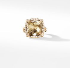 The Châtelaine® Collection is a perfect fusion of David and Sybil Yurman’s combined art—the marriage of a sculptor and a painter—form and color. 18-karat yellow goldChampagne citrine, 9.50 total carat weightStone, 14mmPavé diamonds, 0.30 total carat weightRing, 18mm Women's Rings, Bezel Ring, Chatelaine, Champagne Gold, High Jewelry, David Yurman, How To Make Ornaments, Morganite, Jewelry Pouch