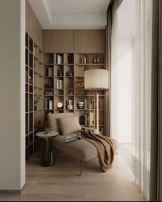 a living room filled with furniture and bookshelves next to a wall full of shelves