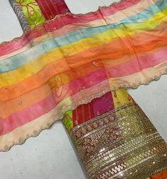 Chinon Heavy Embroidery Multi Colour Unstitched Suits Dress Material With Organza Dupatta  Fabric : Chinon Embroidery Work Top Fabric : 2.5 Yard Bottom : 2.5 Yard Dupatta : 2.5 Yard Colourful Dupatta Multi, Multi Colour Dupatta, Festival Multicolor Embroidered Dupatta, Multicoloured Dupatta, Semi-stitched Multicolor Chinon Dupatta, Semi-stitched Multicolor Embroidered Dupatta Fabric, Black Dress Pants Outfits, Dress Pants Outfits, Straight Fit Pants