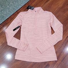 Nwt Nike Dri-Fit 1/2 Zip Long Sleeve Tee. It Is A Peachy Pink With Metallic Gold Accents. Sporty Long Sleeve Pink Tops, Sporty Pink Long Sleeve Top, Nike Fitted Long Sleeve Tops, Pink Stretch Long Sleeve Top, Nike Pink Long Sleeve Tops, Pink Nike Long Sleeve Tops, Pink Long Sleeve Nike Tops, Nike Tops For Spring Workout, Nike Pink Tops For Spring