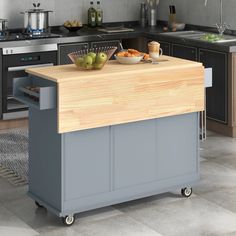 a kitchen island with food on it in front of a stove top oven and sink