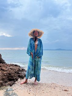 Enhance your everyday style with the subtle allure of patterns and colors in our Dragon Tie Dye Kimono Jacket, inspired by the ocean. This kimono robe effortlessly embodies chic resort-style vibes while ensuring comfort. Hand-stitched from 100% soft rayon fabric and meticulously tie-dyed by skilled artisans, it boasts both quality craftsmanship and artistic flair. With a dropped hemline and a flowing oversized fit, this long kimono jacket effortlessly infuses a laid-back, cool aesthetic into all Vacation Beach Cover-up Kimono With Kimono Sleeves, Blue Beachwear Cover-up For Loungewear, Blue Beachy Cover-up For Loungewear, Kimono Beach Cover-up With Kimono Sleeves For Vacation, Beach Cover-up Kimono With Kimono Sleeves For Vacation, Vacation Kimono With Kimono Sleeves For The Beach, Beach Season Wrap Kimono Beachwear, Beachwear Wrap Kimono For Beach Season, Beachwear Wrap Kimono For Day Out