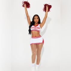 the cheerleader is posing in her red and white outfit with pom poms