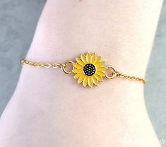 "This listing is for a sunflower charm bracelet. You'll be able to choose your bracelet length by using the drop-down menu. Each bracelet comes with a 3\" extender. **Please see the second photo for scale! If you're on the mobile site, just swipe to the side. :) ITEM CARE: Avoid contact with water, for best results. - - - - - - - Sign up for our newsletter to receive coupons and updates on new items! Follow the link: ♦ ♦ ♦ http://eepurl.com/cG7GGT ♦ ♦ ♦ - - - - - - - This is our third shop for jewelry. If you're looking for something a bit more \"personalized\", then just follow these links: www.etsy.com/shop/metalspeak www.etsy.com/shop/metalspeaktoo - - - - - - - Thank you so much for dropping by. :) Please don't hesitate to contact us if you need anything! We have a huge supply of charm Personalized Flower Jewelry For Friendship, Personalized Flower-shaped Jewelry For Friendship, Personalized Flower Shaped Friendship Jewelry, Adjustable Hypoallergenic Flower-shaped Jewelry, Personalized Flower-shaped Friendship Jewelry, Adjustable Yellow Sunflower Design Jewelry, Personalized Adjustable Flower-shaped Jewelry, Adjustable Personalized Flower-shaped Jewelry, Adjustable Flower Jewelry For Mother's Day