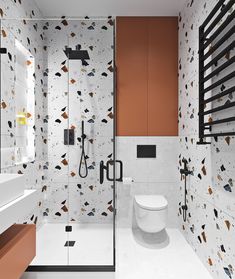 a modern bathroom with an orange accent wall