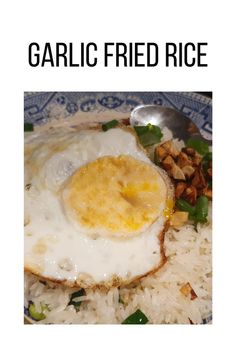 an egg is fried on top of rice