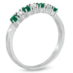 0.37ctw Emerald and Diamond Band Ring in 14k White Gold. The round emerald in this ring have a total carat weight of 0.22 carats. The diamonds have a total carat weight of 0.15 carats. Emerald Diamond Ring With Diamond Accents, Emerald Diamond Ring With Brilliant Cut, Green Diamond Ring With Half Eternity Band, Green Diamond Half Eternity Ring, Green Diamond Ring With Round Band, Green Diamond Half Eternity Round Cut Ring, Emerald Diamond Half Eternity Promise Ring, Emerald And Diamond Band, Diamond Band Ring