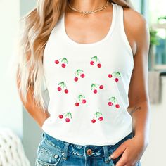 A cute spring summer season women's racerback tank top featuring a cherries design. A great gift for foodies, plant lovers and gardeners!  Free shipping on orders over $35 USD! Sizing: These are soft and comfy racerback tank tops. They are slim fit and light fabric which is nice and cool for summer. Care Instructions: Our tank tops are happy to be machine washed at (max 30C or 90F); Do not bleach. Tumble dry on a low heat. Do not iron. Do not dryclean. Production Time: Items are made to order, and production time is between 2-5 days. Delivery Time: Printed and shipped from the USA. Delivery time for the US is between 2-7 days. Refunds: Should you wish to return your item for a full refund please return the item in its original state within 30 days. Buyer pays return postage. Please send me Fruit Tank Top, Cottage Core Clothes, Core Clothes, Coquette Clothing, Summer Care, Cherry Print, Cute Spring, Fashion Top, Top Summer