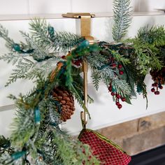 a christmas tree with pine cones hanging from it's branches