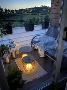 a balcony with a lit candle on the floor