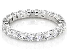 Bella Luce ® white diamond simulant 3.50ctw round, rhodium over sterling silver eternity band ring. Measures approximately 0.88"L x 0.13"W and is not sizable. Fine Jewelry Cubic Zirconia Eternity Band Round Cut, White Round Eternity Band Fine Jewelry, Round Eternity Band With Diamond Cut Cubic Zirconia, Diamond White Cubic Zirconia Round Cut Eternity Band, White Gold Cubic Zirconia Round Cut Eternity Band, White Cubic Zirconia Eternity Band, Channel Set Round White Gold Eternity Band, White Round Diamond Cut Eternity Band, White Gold Round Channel Set Eternity Band