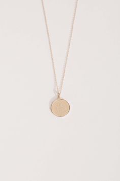 METAL 14kt Yellow Gold 16mm A gold cast of a Bahamian penny to remind you of the sunny days of vacation. Stunning when worn alone, or when layered with a clean chain such as the JP CABLE LINK CHAIN or JP BALL CHAIN. Gold Coin Pendant, Heavy Chain, Coin Pendant Necklace, Gold Coin, Coin Necklace, Coin Pendant, Ball Chain, Link Chain, Sunny Days