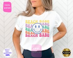 Beach Babe Shirt, Summer Shirt, Summer Gift Ideas,Beach Vibes, Vacation Shirt, Summer Love, Beach Shirt, Travel Shirt, Beach Lover Gift  DESCRIPTION   * Backside design is an additional fee, please make sure to add the fee to your purchase.  * If you want to add or change anything on the existing design that we show in the display picture, please contact the seller from the message box to ask if the changes and additional requests can be done or not, if you do not ask and request for it without asking in the order we will ship the item as it is without the requests done. * Please check the color charts for the size and type of the shirt you want, not every color is available for each type of shirt, drop-down comes automatically with every color but they are not available for each item so p Beach Graphic Cotton Tops, Summer Beach Tops With Graphic Design, Casual Beach Tops With Graphic Design, Beach Cotton Tops With Graphic Design, Cotton Beach Tops With Graphic Design, Beach Graphic Tee With Graphic Design, Trendy Graphic Print Shirt For Beach Season, Trendy Shirt With Graphic Print For Beach Season, Trendy Funny Print Shirt For Beach Season