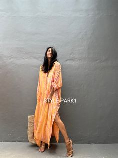 Jimbaran dress  is an oversized long sleeve soft rayon voile Long shirts  dress  .  This Oversized shirt dress is designed to flatter every body type and fit numerous occasions. 👍Included tali - f e a t u r e s - - Relaxed fit - Front pockets Fabric: 100% Soft rayon voile  Style:oversized fit Color:Bali Hand tie dyed peach & multi motif Wash :Hand cool wash  - measurement -  - One size fit all -  I recommend American size M to XL Chest /164cm/ 64inch(round) Length/135cm/53inch Transparent - it' Oversized Long Sleeve Tunic For Beach Cover-up, Summer Beach Maxi Shirt Dress, Long Shirt Dress For Beach In Fall, Summer Long Sleeve Kaftan For Beach Cover-up, Oversized Beach Dress For Fall, Flowy Long Sleeve Dresses For Beach Cover-up, Relaxed Fit Shirt Dress For Beach In Fall, Long Sleeve Beach Cover-up Dress, Bohemian Fall Shirt Dress