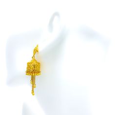 Crafted from 22k gold and weighing 16.4 grams, these earrings feature a unique floral design within a dangling cage, all in a polished yellow gold finish. The earrings, with a length of 2.5 inches, are secured with screw back posts, offering both sophistication and comfort. This distinctive style combines the charm of floral motifs with the elegance of a cage structure, making them a standout accessory. Ideal for those seeking jewelry that merges traditional elements with innovative design, these earrings are perfect for adding a touch of uniqueness and elegance to any outfit, showcasing exquisite craftsmanship and timeless beauty. Product Details Gold Purity(karat): 22k Gold Weight(grams): 16.4 Item Finish: Yellow Gold Earring Style: Hanging/Jhumki Earring Length: ﻿2.5" Earring Post: Scre Cage Earrings, Unique Floral Design, Jhumki Earrings, Earring Post, Gold Earring, Yellow Gold Earring, Beauty Product, Floral Motifs, Innovative Design