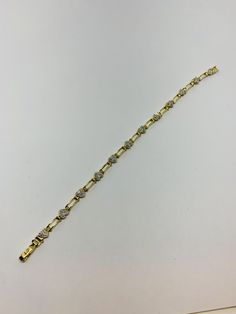 "Beautiful excellent condition 10kt yellow gold heart motif diamond encrusted bracelet. Genuine diamonds are set in a white gold hearts. Twelve hearts make up this link bracelet which measures about 7 1/2\" long when open. Fabulous unusual secure clasp. This bracelet is straight out of a jewelry stores jewelry case and was never worn. Perfect condition. Mother's Day and Easter are coming up! Weighs about 7.32 grams. Nice sparkly white diamonds . Hallmark JJ.about 1/3 ct if high quality diamonds. Diamond Oval Link Bracelets For Anniversary, Formal Yellow Gold Diamond Bracelet With Accents, Yellow Gold Diamond-accented Bracelet For Anniversary, Diamond Heart Bracelet With Accents, Diamond Heart Bracelet With Diamond Accents, Heart Shaped Diamond Bracelet With Accents, Anniversary Oval Link Diamond Bracelet, Anniversary Yellow Gold Bracelet With Diamond Accents, Classic Diamond Heart Bracelet In White Gold