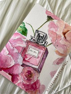 a painting of pink flowers and a perfume bottle on a white sheet with a name tag