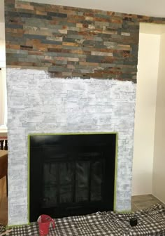 the fireplace is being painted and ready to be installed