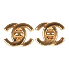 These vintage Chanel earrings of 24K gold plated metal are the iconic CC turn lock with clip on backings. Origin: France Collection: 95ACondition: Vintage; Excellent. Minor scratches. Accompanied by: Chanel box and pouchMeasurements: 1.5" width x 1" height Gold Classic Clip-on Plug Earrings, Luxury Gold-tone Earrings With Logo Plaque, Elegant Yellow Gold Earrings With Gold-tone Logo, Classic Gold-tone Clip-on Jewelry, Classic Yellow Gold Earrings With Logo Plaque, Classic Clip-on Earrings For Anniversary, Tarnish Resistant, Formal Luxury Gold Plug Earrings, Classic Gold Clip-on Earrings With Polished Finish, Luxury Gold Plug Earrings For Formal Occasions