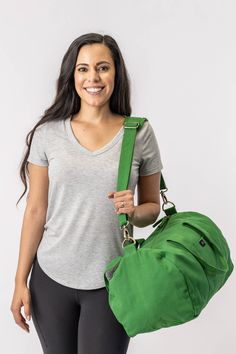 Nothing beats the simplicity and functionality of a good duffle bag—except maybe our Bumi Eco Duffel Bag, made with the good of the environment and people in mind! The perfect size for a spontaneous weekend getaway or when you need a little more room to haul daily gear for work or athletics.  Bag: 13"(H) x 20"(W) x 12"(D) Made with 12 to 14 oz Certified Fairtrade Organic cotton canvas Approximately 56L capacity Main compartment zippers with long pulls Internal zippered hanging pocket sized 9” (H Feeding America, Shipt Shopper, Weekend Getaway, Moss Green, Cotton Bag, Duffel Bag, Corporate Gifts, Online Purchase, Fair Trade