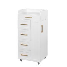 a white cabinet with gold handles and drawers on casteors, against a white background