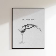 a black and white photo of a martini glass