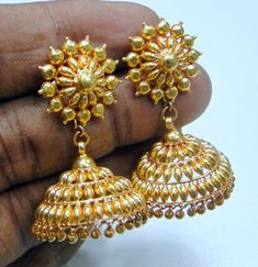 Vintage 22 karat solid gold detailed workmanship dangle earring pair (jumkee). total weight of pair-16.5 grams(0.58 ounces), length-4 cm, diameter of bottom-2.2 cm,, material-22 k solid gold. Antique Gold Earrings With Latkans, Gold Brass Dangle Jhumkas, Gold Brass Drop Jhumkas, Heavy Gold Dangle Earrings, Heavy Gold Jhumkas Drop Earrings, Antique Heavy Gold Earrings, Yellow Gold Brass Jhumkas For Festivals, Festival Yellow Gold Brass Jhumkas, Heavy 22k Gold Round Jhumkas