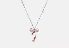 COACH® | Bow Pearl Pendant Necklace Gift Jewelry Pendant With Bow, Gift Bow Pendant Jewelry, Bow Pendant Jewelry For Gifts, Formal Bow Jewelry For Valentine's Day, Valentine's Day Formal Bow Jewelry, Coach Necklace With Adjustable Chain For Gift, Coach Necklace With Adjustable Chain As Gift, Gift Jewelry With Pink Bow, Pink Bow Jewelry Gift