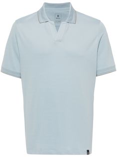 light blue cotton blend piqué weave logo tag contrasting trim polo collar split neck short sleeves short side slits straight hem Blue Polo T-shirt With Striped Collar, Light Blue Summer Polo Shirt, Blue Polo Shirt With Striped Collar, Blue Polo Shirt With Collar And Placket, Blue Polo Shirt With Collar, Blue Polo Shirt With Collar Placket, Blue Collared T-shirt With Ribbed Collar, Blue Johnny Collar Polo Shirt For Summer, Classic Light Blue Polo Collar Top