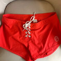 Never Worn Bright Board Shorts Women 3 Red Stretch Swim Trunks For Beach Season, Red Cotton Shorts For Beach Season, Casual Red Beach Shorts, Red Cotton Swim Trunks For Summer, Red Vacation Bottoms With Built-in Shorts, Red Short Swim Trunks For Beach, Red Bottoms With Built-in Shorts For Vacation, Red Stretch Bottoms For Vacation, Sporty Red Bottoms For Vacation