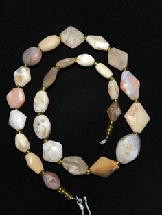 A beautiful string of Bended white agate natural found from Afghanistan dating 1800 yrs. They are found at that time in Afghanistan mostly but also some found in India and Pakistan too. They were used as a special charm jewellery by the affluents at that time period. Beautiful counter bronze are decorated further in between the beads. Spiritual Round Chalcedony Bead Jewelry, White Hand-strung Rondelle Necklace, White Hand-strung Amulet Necklace, Spiritual Single Strand Oval Bead Jewelry, Spiritual Single Strand Jewelry With Oval Beads, Polished Agate Bead Jewelry, Polished Round Agate Bead Jewelry, Agate Polished Round Beads Jewelry, Artisan White Gemstone Beads Necklaces