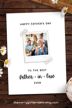 a father's day card with daisies on the table