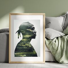 a framed photograph sitting on top of a couch next to pillows