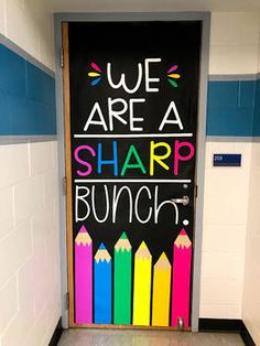 a classroom door decorated with colorful crayons and the words we are a sharp bunch