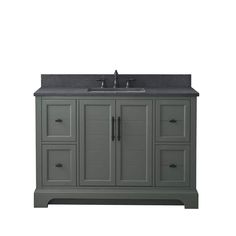 a gray bathroom vanity with black counter top