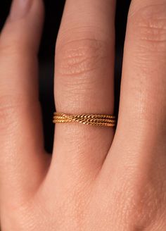 A bold, layered ring made from sparkling twisted metal. This beautiful wrapped ring will become a staple in your wardrobe. This ring is handcrafted out of a twisted, rope-textured wire that is wrapped multiple times to create the appearance of stacked rings. This listing is for ONE SINGLE ring in 14K GOLD FILL.  SIZING NOTE: Because this style is wider than a classic Stacking Ring, we recommend sizing up* by a QUARTER to a HALF size from your US Fashion Ring Size (Bridal size is different than U Stacked Rings, Layered Rings, Twisted Metal, Single Ring, Large Ring, Fashion Ring, Gold Texture, Cleaning Jewelry, Stacking Rings