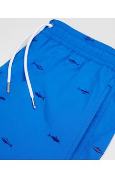 No need to fish for compliments in these sporty embroidered swim trunks topped with a comfy drawstring waist. Elastic/drawstring waist Side-seam pockets; back patch pocket Lined 100% polyamide Machine wash, line dry Imported Casual Blue Swim Trunks With Side Pockets, Casual Pool Shorts With Functional Drawstring, Blue Cotton Swim Trunks With Pockets, Casual Swimwear With Pockets For Pool, Blue Swimwear With Pockets And Relaxed Fit, Blue Beachwear Bottoms With Side Pockets, Blue Relaxed Fit Swimwear With Pockets, Blue Swimwear With Pockets For Spring, Casual Cotton Swimwear With Drawstring