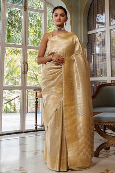 Gold banarasi silk saree with zari woven bloom motifs all over. Comes with an unstitched blouse piece. - Aza Fashions Elegant Katan Silk Pre-draped Saree With Self Design, Elegant Handloom Pre-draped Saree For Diwali, Gold Katan Silk Pre-draped Saree For Eid, Elegant Art Silk Traditional Wear For Navratri, Gold Anarkali Banarasi Silk Pre-draped Saree, Elegant Art Silk Blouse Piece With Pallu, Festive Banarasi Silk Blouse With Zari Weaving, Banarasi Silk Pre-draped Eid Saree With Self Design, Elegant Banarasi Silk Pre-draped Saree With Unstitched Blouse