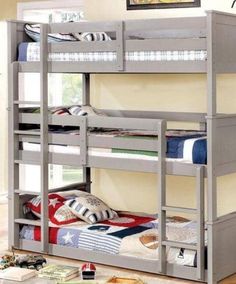 a bunk bed with two sets of ladders on the bottom and one set of drawers underneath