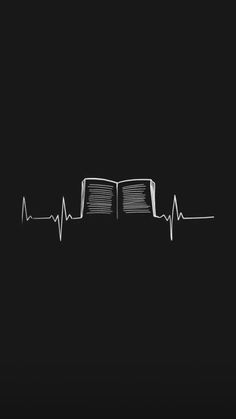 an open book with a heart beat on the cover is shown in black and white