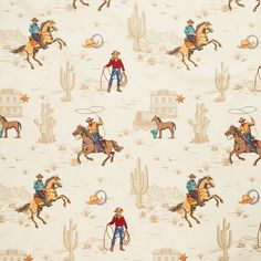 the cowboy is riding his horse and lasso in the desert pattern on this white cotton fabric