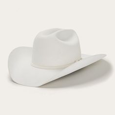 A premium wool cowboy hat featuring a classic cattleman's silhouette with a taller 4 5/8" crown and a curved 4" brim. Adorned with refined accents like a 3-piece silver buckle on the matching hatband, this high-quality hat offers both style and elegance. The leather interior sweatband ensures comfort and keeps you cool. Elevate your Western look with this exceptional cowboy hat. Head circumference size: Adjustable (22.83-23.62 in) (58-60 cm) Brim: 4" Crown: 4 5/8" Material: 4X Fur Felt Accents: White Cowboy Hat, Tuxedo Accessories, Chapeau Cowboy, Felt Cowboy Hats, Thigh Boot, Western Hats, Quality Hats, Cowgirl Hats, Hat Band