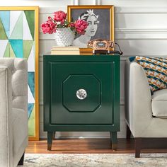 a green cabinet sitting in the corner of a living room next to a white chair