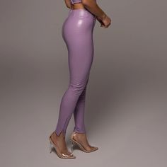 Materials: 100% Pu 88% Polyester 12% Spandex Product Origin: Imported Washing Instructions: Dry Clean Only Model Is Wearing Size S Trendy High-cut Leg Pants With High Stretch, Trendy High Stretch Pants With High-cut Leg, Trendy High-cut Leg Tight Pants, Trendy Tight Pants With High-cut Leg, Purple Stretch Elastane Bottoms, Stretch Purple Elastane Bottoms, Stretch Elastane Purple Bottoms, Elastane Party Leggings, Chic Elastane Leggings For Party