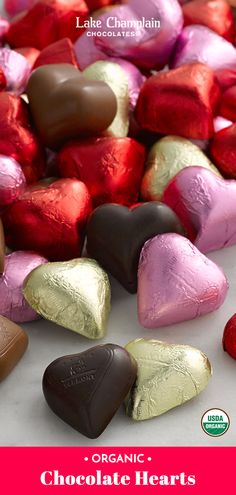 heart shaped chocolates are sitting next to each other on a white surface with the title organic chocolate hearts