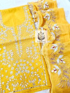 Item Overview ATHARVA Hand Embroidery Salwar Kameez/Yellow Chanderi/Elgant Gota Patti Border Chiffon Dupatta/Custom Stitch Unstitch/Custom Anarkali Dno. CH1710 Fabric: * Shirt Chanderi Silk 2.5 Mts, yellow/Neck Embroidery * Dupatta:Chiffon Chinnon, Yellow, Elegant Gota Patti border Dupatta 2.5 Mts. * Bottom Santoon Silk 2.5 Mts. Excusive Hand Embroidered Party Wear Punjabi Suit. Customization: * Fabrics Customization: Designs Can be made in different Fabrics. *Color Customization: Designs Can be Yellow Unstitched Anarkali Set With Mirror Work, Unstitched Yellow Anarkali Set With Mirror Work, Designer Yellow Salwar Kameez With Mirror Work, Festive Yellow Salwar Kameez With Mirror Work, Yellow Chinon Kurta With Mirror Work, Yellow Chinon Sets With Zari Work, Festive Yellow Anarkali Set With Chikankari Embroidery, Yellow Anarkali Set With Mirror Work, Yellow Anarkali Set With Chikankari For Festive Occasions